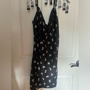 Women’s black dress with butterflies